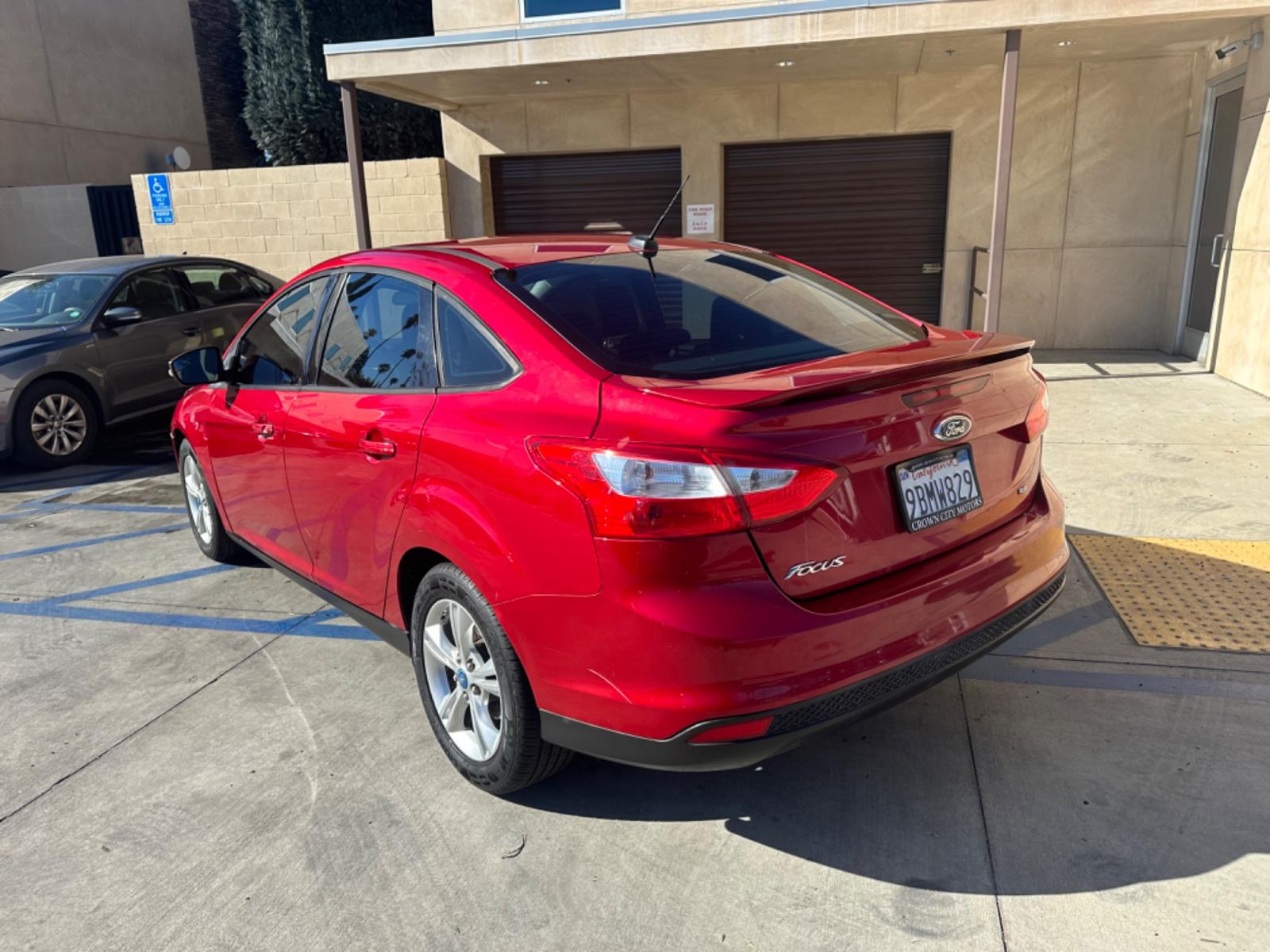 2012 RED /BLACK Ford Focus SE Sedan (1FAHP3F29CL) with an 2.0L L4 DOHC 16V engine, AUTOMATIC transmission, located at 30 S. Berkeley Avenue, Pasadena, CA, 91107, (626) 248-7567, 34.145447, -118.109398 - New Tires! Nice Interior! drives and looks good! Bad credit? We can help! We are the bank. All our cars are thoroughly inspected and reconditioned by our technicians. FREE CARFAX report. Stop by or call to speak with our friendly staff. Whether you have bad credit, no credit, bankruptcy, or reposse - Photo #2